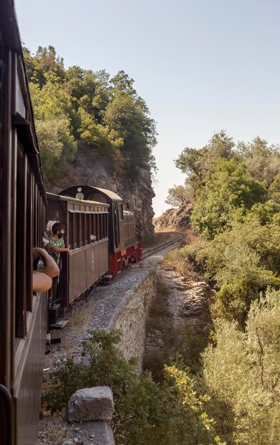 Greece Pelion 08012021 Tourist famous excursion old train of makes its route in the mountains on a sunny summer day