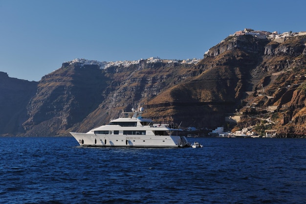 greece santorini island coast with luxury yacht