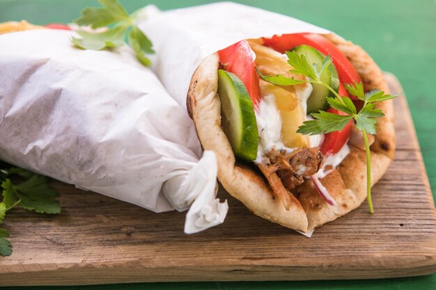 Greek chicken souvlaki ona pita with fresh vegetables with tzatziki sauce