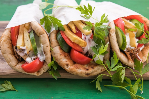 Greek chicken souvlaki ona pita with fresh vegetables with tzatziki sauce