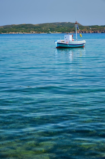 Greek fishing boat in Aegean sea near Milos island Greece