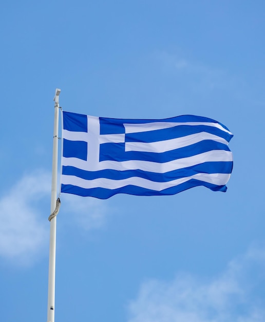 Greek flag waving against blue sky background