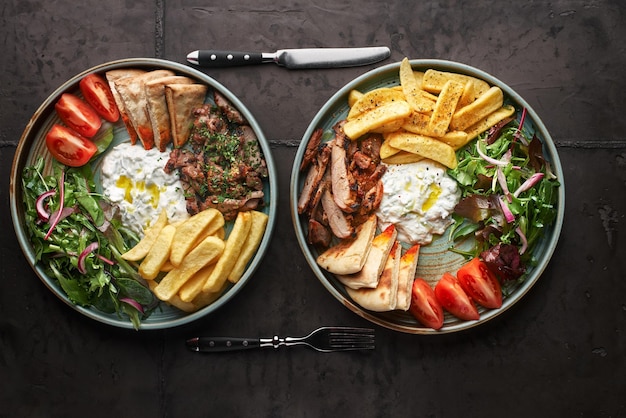 Greek Gyros with chicken or veal with tzatziki on a dark background