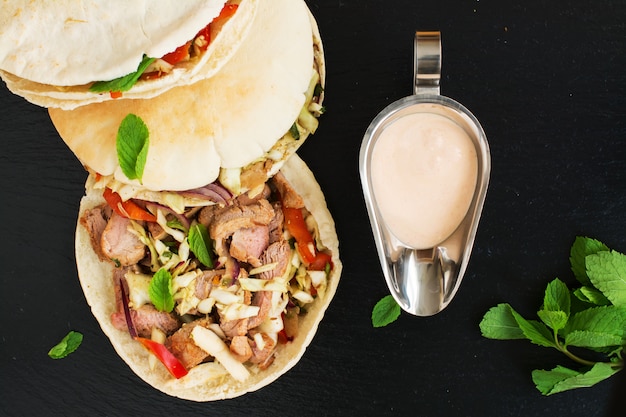 Greek pita bread with meat and salad