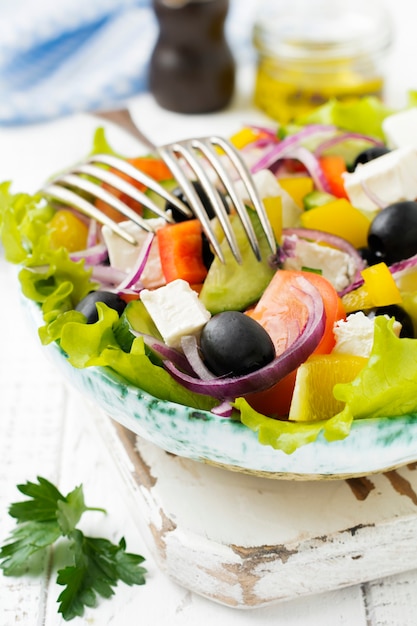 Greek salad in a ceramic plate