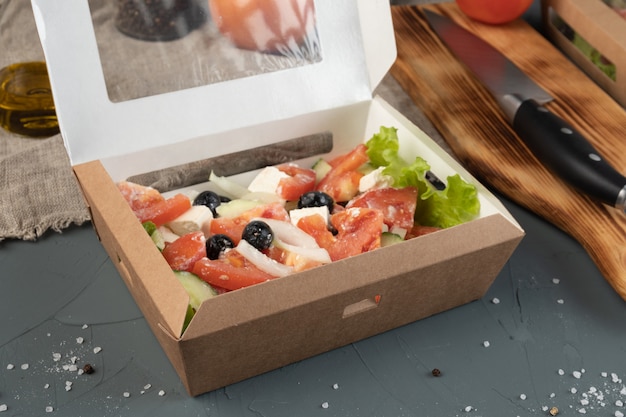 Greek salad in a craft box for delivery