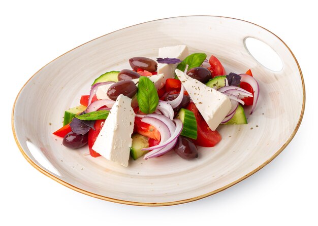 Greek salad in plate isolated on white