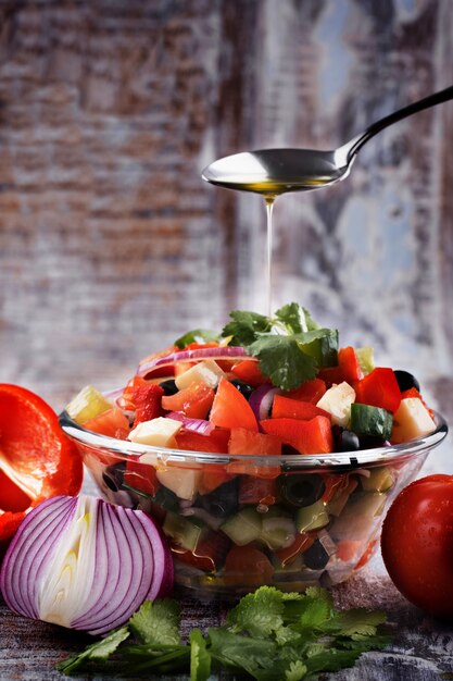 Greek salad served with olive oil