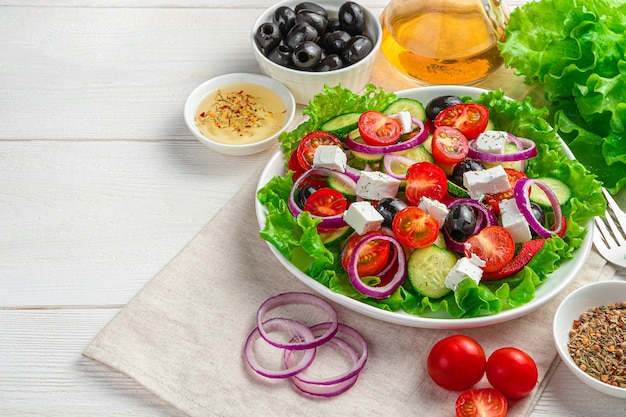 Greek salad on a white wooden