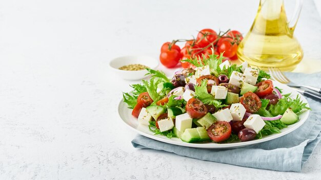 Greek Salad with feta and tomatoes dieting food on white background copy space closeup long banner