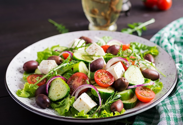 Greek salad with fresh vegetables, feta cheese and kalamata olives