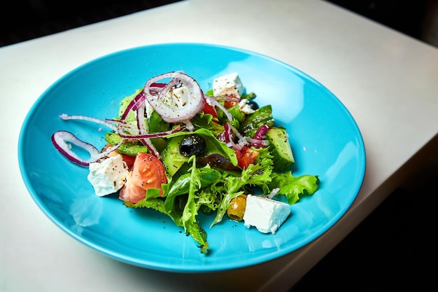 Greek salad with vegetables feta cheese olives and olive oil