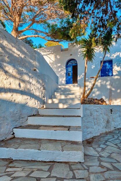 Greek village typical view with whitewashed houses and stairs plaka town milos island greece