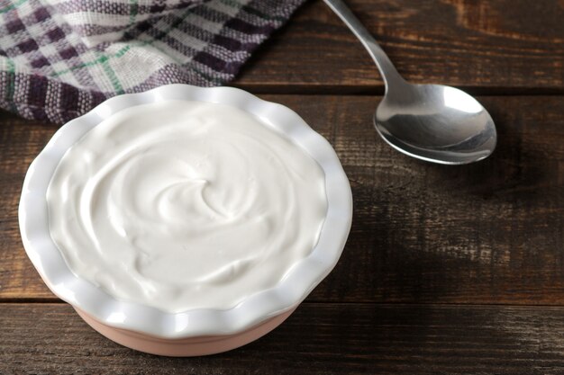 Greek yogurt in a ceramic bowl on the table