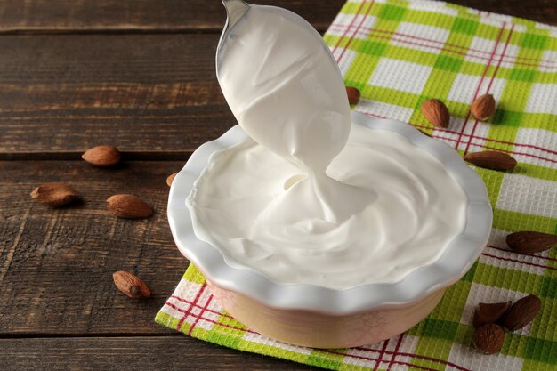 Greek yogurt in a ceramic bowl on the table