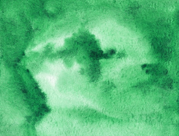 Green abstract watercolor background on textured paper. Hand made watercolor backdrop