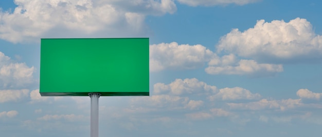 Green advertising panel with sky and clouds background Advertising panel billboard