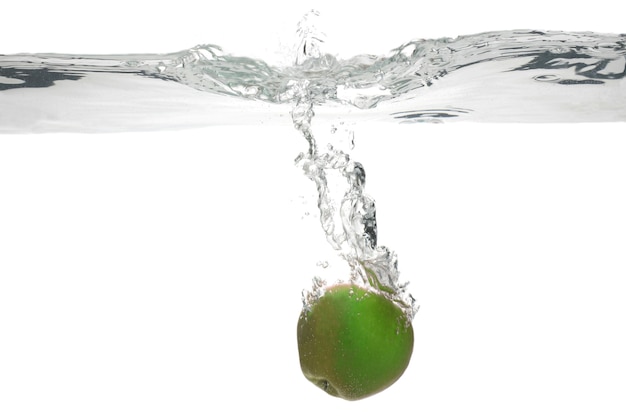 Green  Apple falls into the water. useful vitamin food