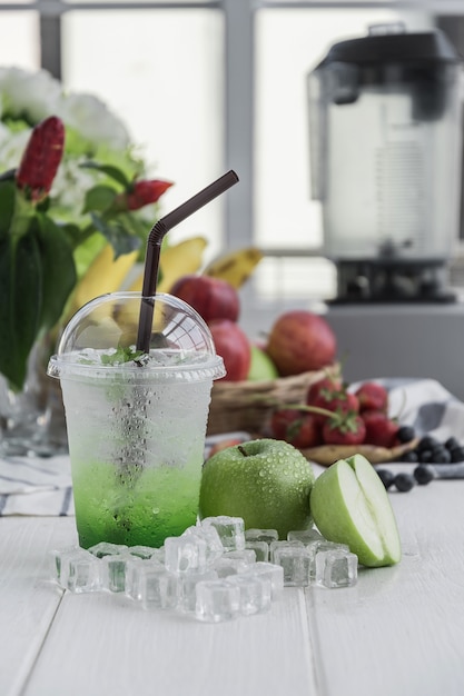 Green apple italian soda arranged on wood table