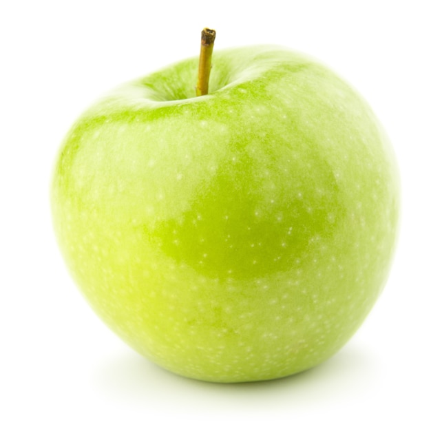 Green apple on a white with a shadow.