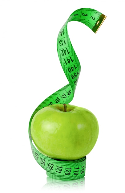 Green apple with measuring tape isolated on white