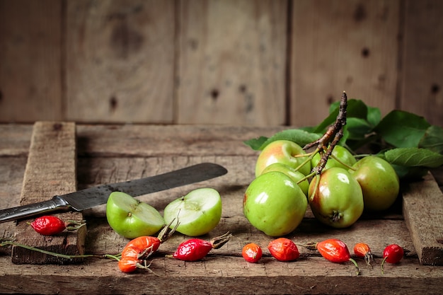 Green apples on an old box