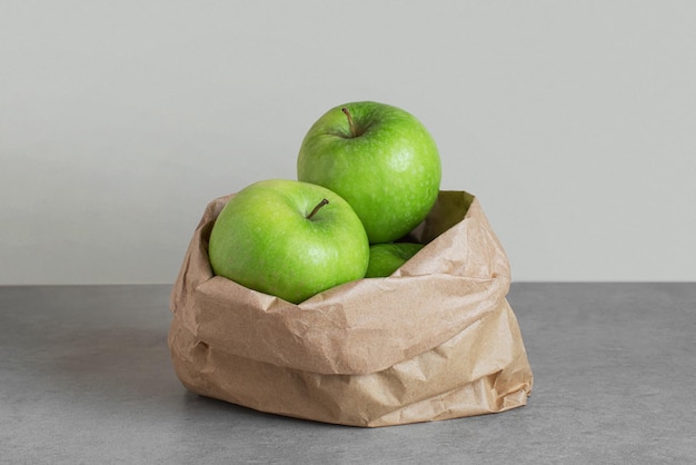 Green apples in a paper bag Zero waste