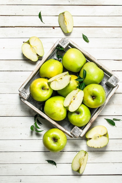 Green apples in a small box.