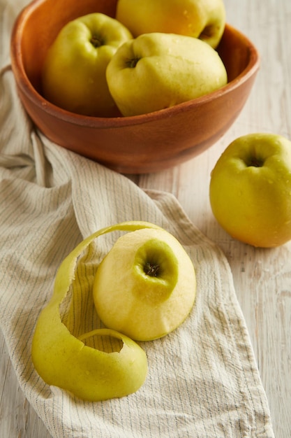 Green apples in a wooden bowl