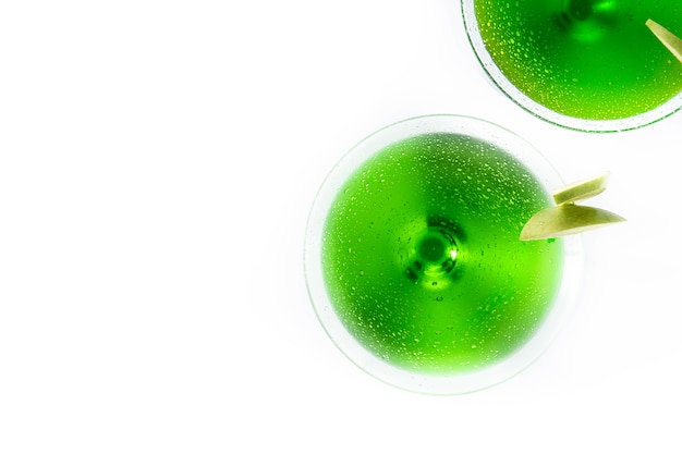 Green appletini cocktails in glass isolated on white surface