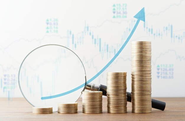 The green arrow is going up the stacks of coins arranged in a bar graph