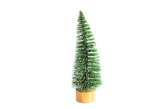 Green artificial Christmas tree in the shape of a triangular brush o