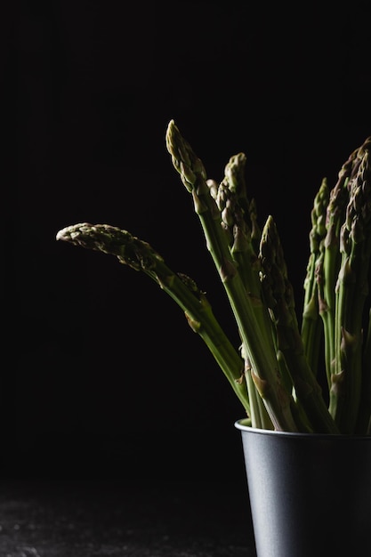 Green asparagus on a black background