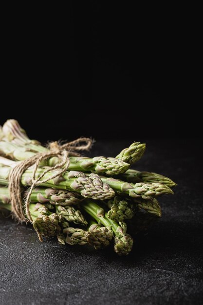 Green asparagus on a black background