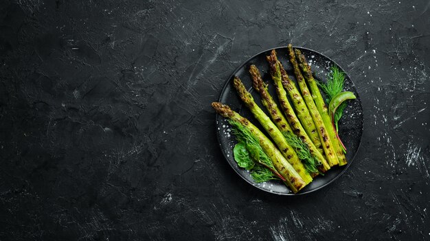 Green asparagus grilled with spices Healthy food Top view Free space for your text