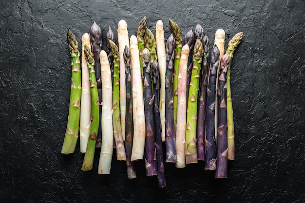 Green asparagus sprout on black board