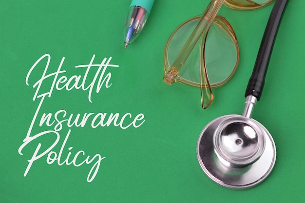 Photo green background written with text health insurance policy