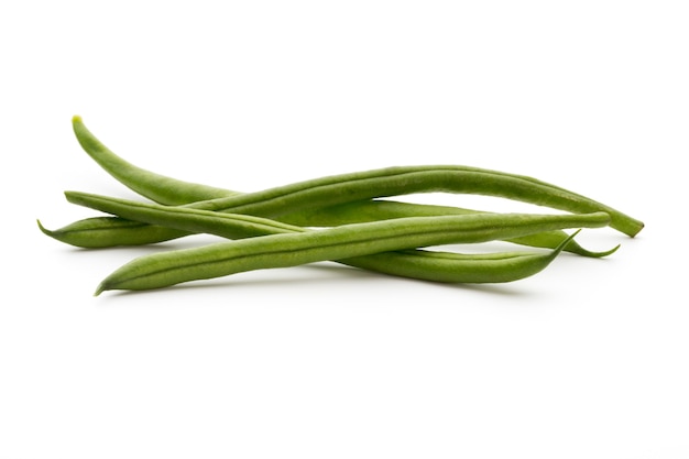 Green beans isolated on a white surface.