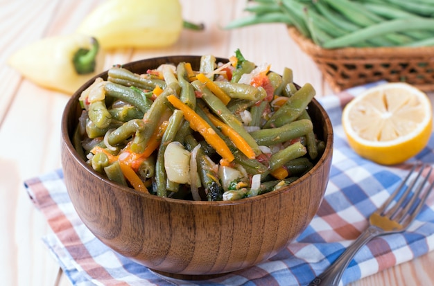 Green beans with garlic in a brown bowl