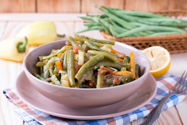 Green beans with garlic in a brown bowl