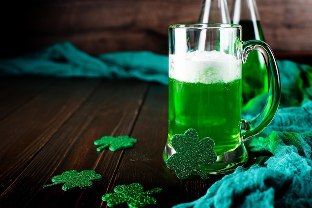 Green beer pint for Saint Patrick day on wooden table