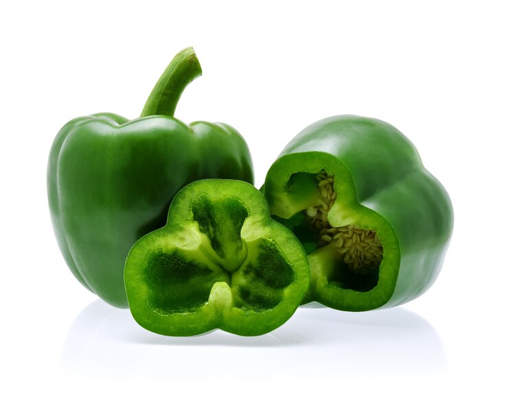 Green bell peppers isolated on white.