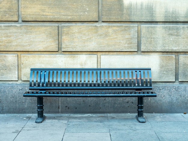 Green bench with wall