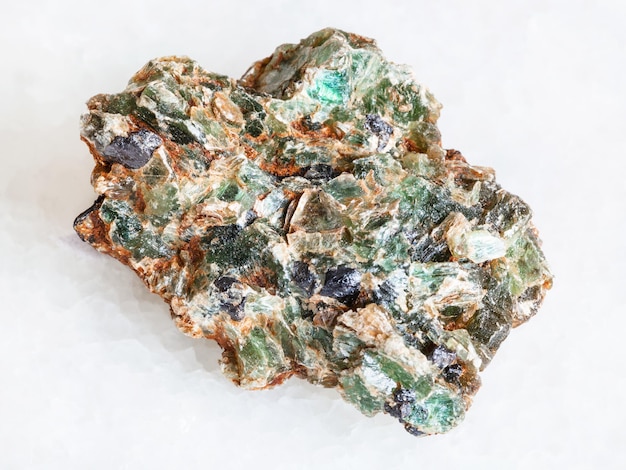 Green beryl crystals in druse on white