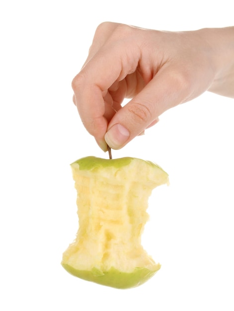 Green bitten apple in hand isolated on white