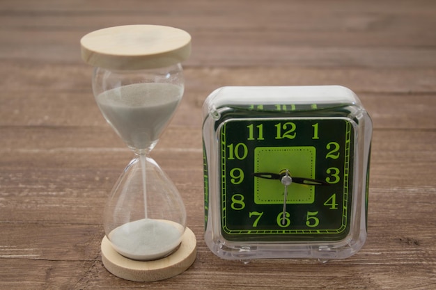 A green and black clock with the numbers 1 and 2 on it.