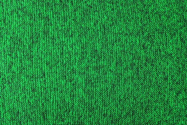 Green and black melange knitted texture and flat background