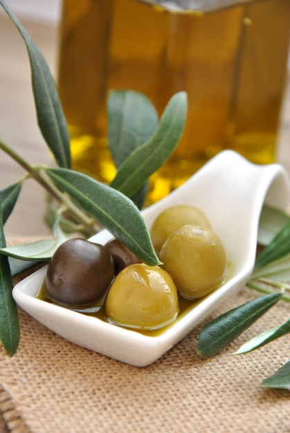 Green and black olives with olive oil