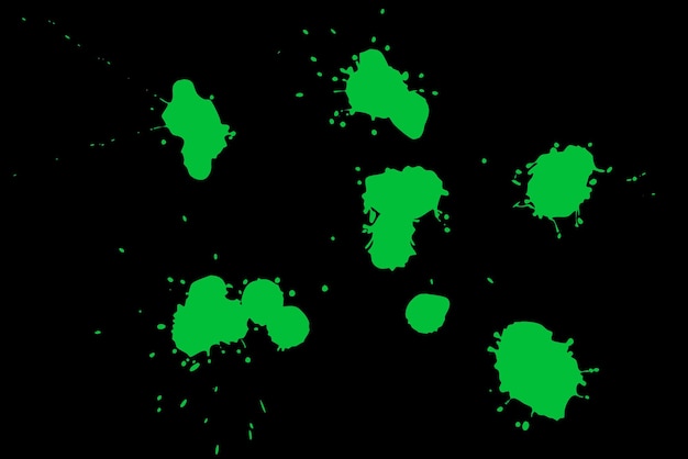 Фото Зеленое пятно на черном фоне пятна краски на листе бумаги