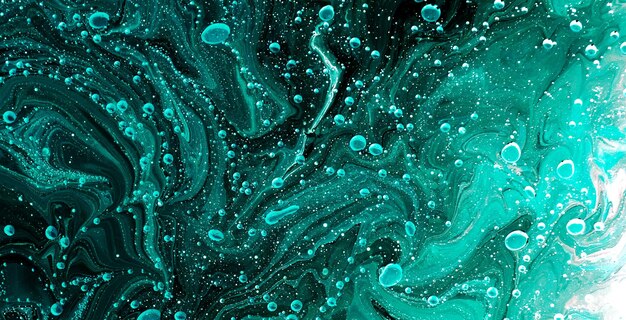 Photo a green and blue abstract background with the bubbles in the middle